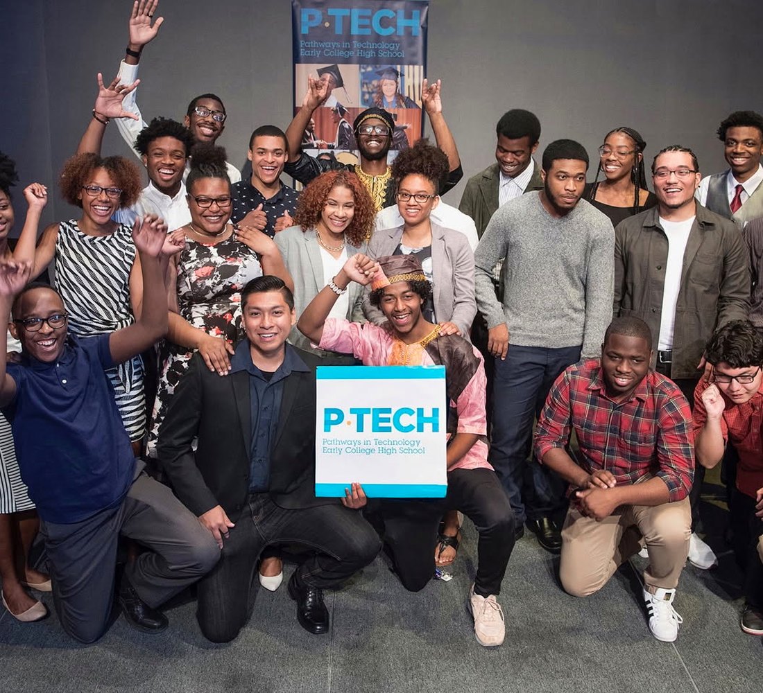 P-TECH students gathered with the P-TECH banner