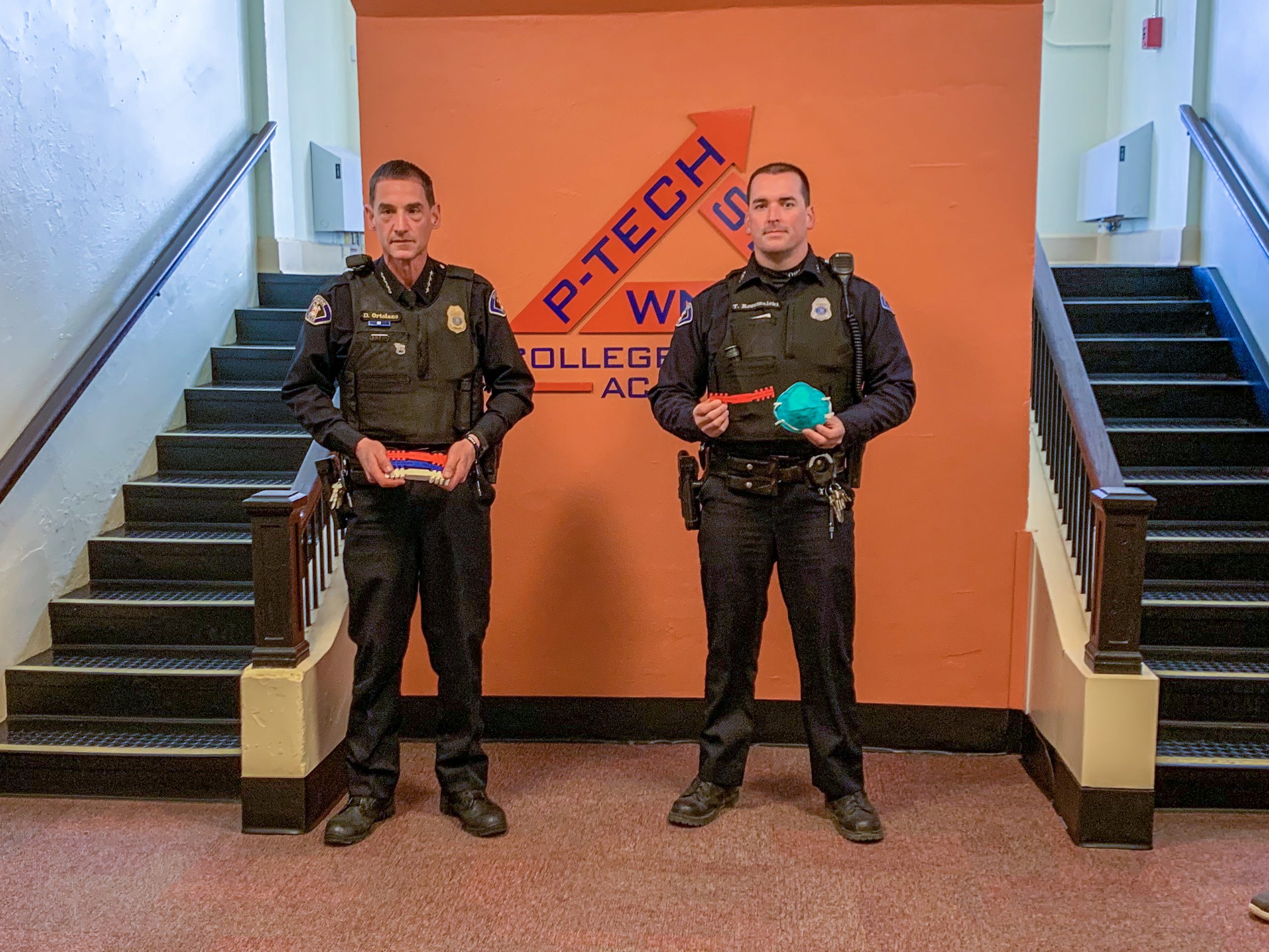 WNY P-TECH College and Career Academy donated more than 220 specially-designed ear guards to the Dunkirk Fire Department, Dunkirk Police Department, Brooks Memorial Hospital, Elliot Hospital in New Hampshire and Mount Sinai Hospital in New York City. Accepting the donation on behalf of the Dunkirk Police Department were Chief David Ortolano and officer Thomas Rozumalski. Pictured, from left, are Matt Edwards, P-TECH math teacher; Ortolano; Rozumalksi; and Nick Anson, P-TECH CADD teacher.